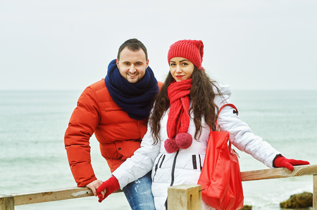 Young loving couple on a walk, dressed in bright clothesの写真素材