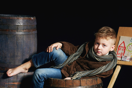 Boy artist with palette and brushesの写真素材