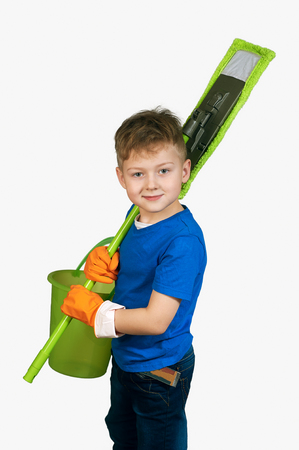 A boy with a MOP and bucket . Little helper .の写真素材