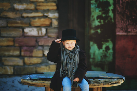stylish retro portrait of a boy in the cylinderの写真素材