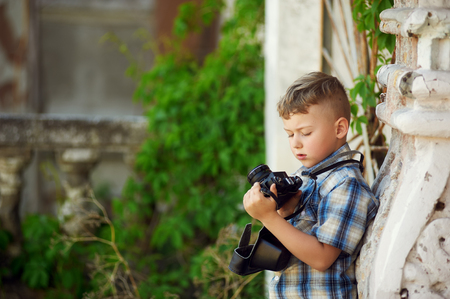 boy with retro camera and city mapの写真素材