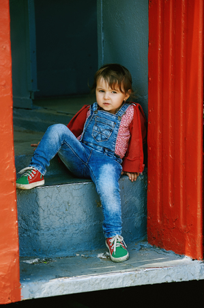 Portrait of a little girl in jeansの写真素材