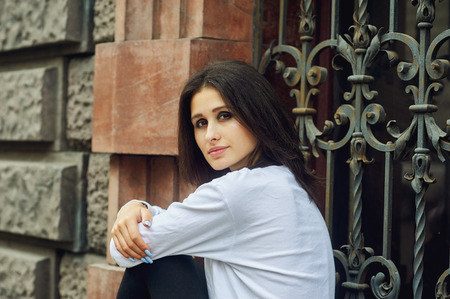 Fashion model on the street. Beautiful young woman in stylish summer clothes