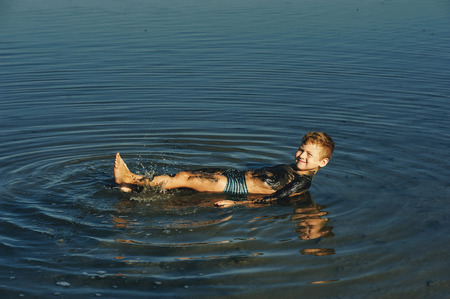 children take mud baths at the resort and having fun with mud . children in the Spa