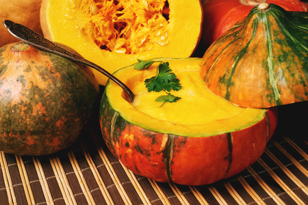 Homemade pumpkin soup on rustic wooden background diet foodの写真素材