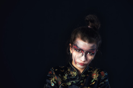 Studio portrait of girl with fancy makeup . Psychological portraitの写真素材