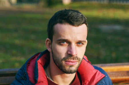 portrait of a young man in a city Parkの写真素材