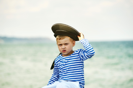 Portrait of happy boy on background of the seaの写真素材