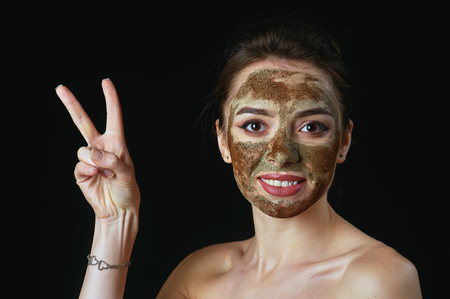 A young woman in a cosmetic mask on her faceの写真素材