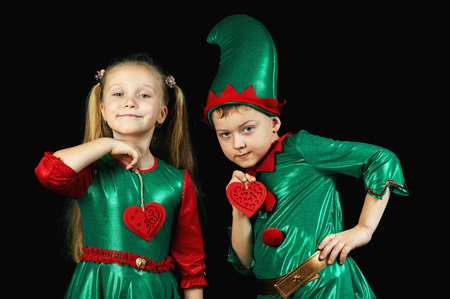 Funny kids in green fancy dressの写真素材