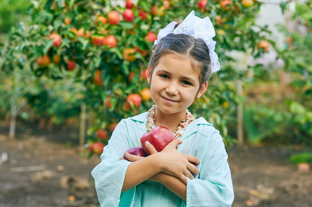 Portrait of a girl with applesの写真素材