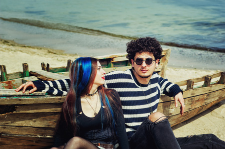 Young stylish romantic couple on the seasideの写真素材