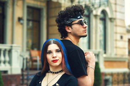 stylish fashionable young couple in the city. Young people in the city
