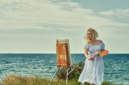 Young woman artist in the open airの写真素材