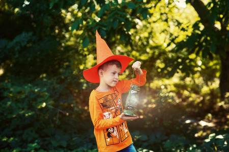 Boy on Halloween day with a lantern in his hands.の写真素材