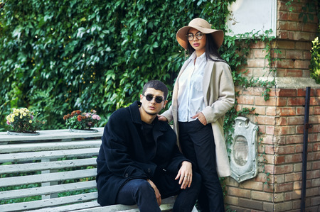 Young couple in town . People in love in the autumn city .の写真素材