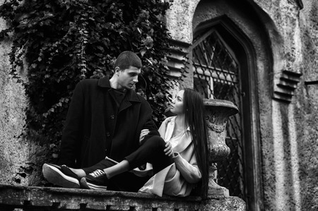 Fashionable young couple in love in the old townの写真素材