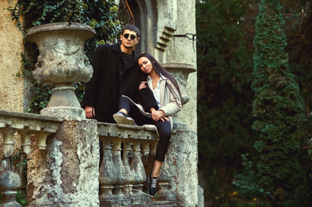 Fashionable young couple in love in the old townの写真素材