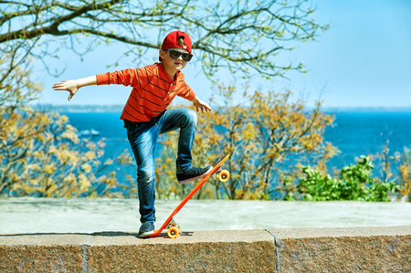 boy on a skateboard in the Park . a child learns to ride a Boardの写真素材