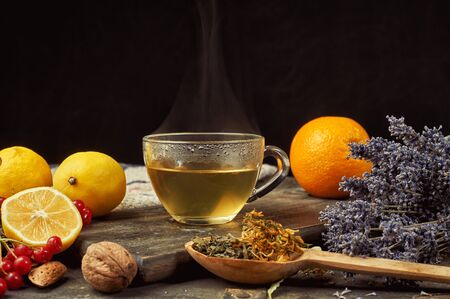 Freshly brewed infusion of green tea with mint, lime and raspberryの写真素材