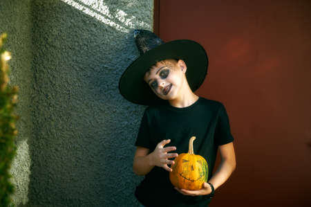 Portrait of a cheerful boy in makeup for Halloweenの写真素材