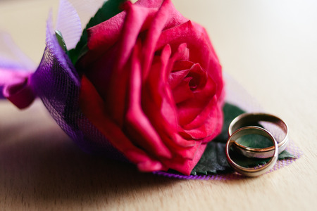 wedding rings on the buttonholeの写真素材