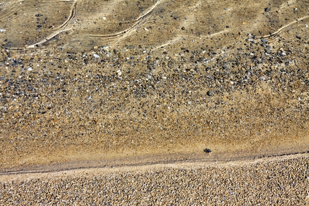 clear water of the lake through which is seen a sandy texture to the bottom, showing the boundary of water and sandの写真素材