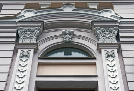 details decoration of the facade of the old building in the city center
