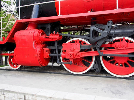 red old steam locomotive, chassis of the locomotive, wheel pairs, connecting rodsの写真素材