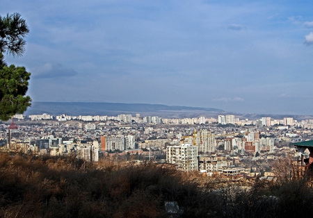 landscape suburb of Tbilisi illuminated by the sun, from a high pointの写真素材