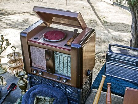 an old tube radio in a wooden case is sold at the flea marketの写真素材
