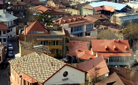various, color, beautiful roofs of the capital of Georgia of the city of Tbilisi lit by the soft...