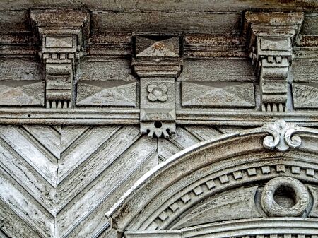 Details of the Carved wooden facade of the old house. Russian architecture. House with carved wooden...