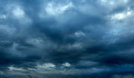 texture of a gray gloomy overcast sky with dark clouds on a summer evening