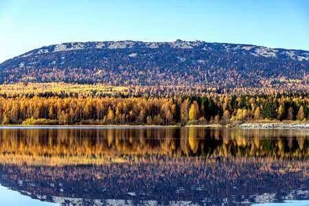 Golden autumn in the vicinity of lake Zyuratkul, colorful trees, Ural mountains, picturesque...