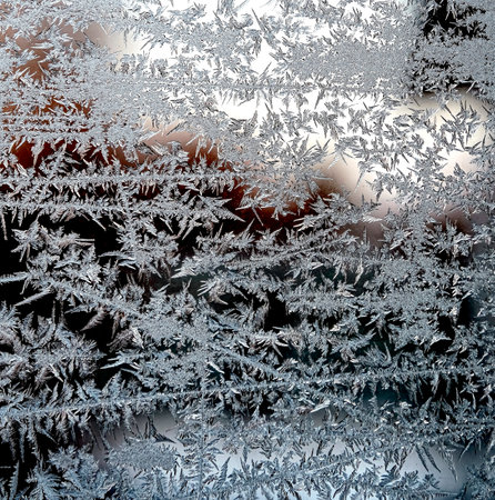 fantastic frost pattern on the winter window, texture of frost patterns, dendritic structure of the imageの写真素材