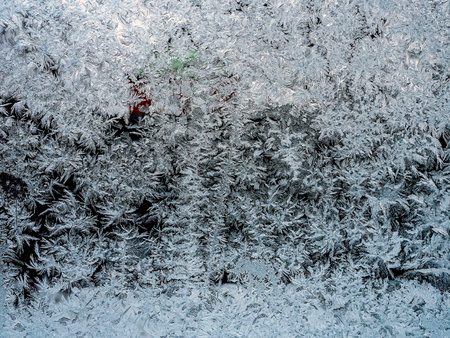 Frosty natural pattern on a winter window, texture of frosty patterns, dendritic image structureの写真素材