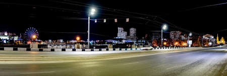 panorama of a deserted illuminated night roadの写真素材