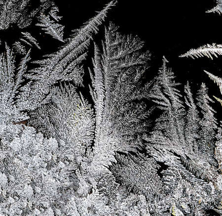 beautiful frosty patterns on the window glass