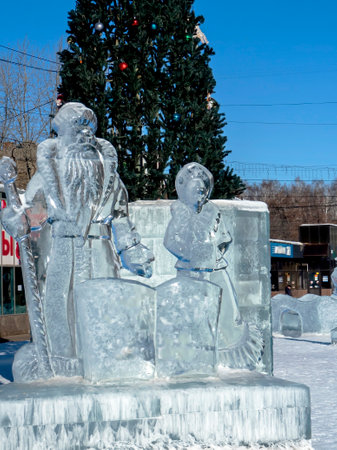 Santa Claus and Snow Maiden and ice figures at the New Year's playground, South Ural, Chelyabinskの写真素材