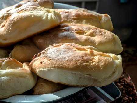 delicious fresh ruddy hot baked pies on a plateの写真素材