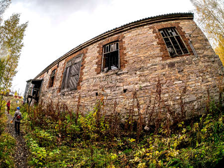 The old abandoned stone house is the former administrative building of the old power plantの写真素材