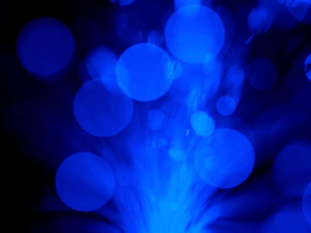 Blue abstract background consisting of blurred lines and circlesの写真素材