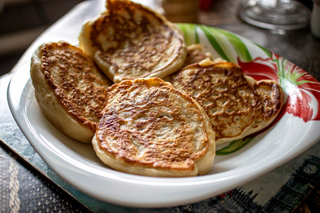 fresh mouth-watering delicious hot pancakes in a plateの写真素材