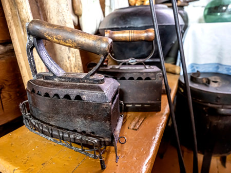 old cast-iron iron heated by coals, an authentic thingの写真素材