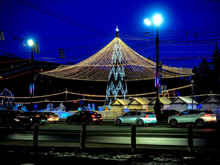 Christmas tree with luminous illuminating at night on the square, Russia, Chelyabinskの写真素材