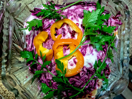 salad with herring, beetroot, carrots, potatoes and eggs laid in layersの写真素材
