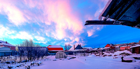 unusual pink clouds in the winter morning skyの写真素材