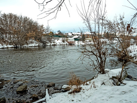 banks of the winter river covered with forestの写真素材