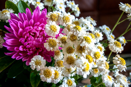 small white chrysanthemums and asters in a small beautiful bouquet